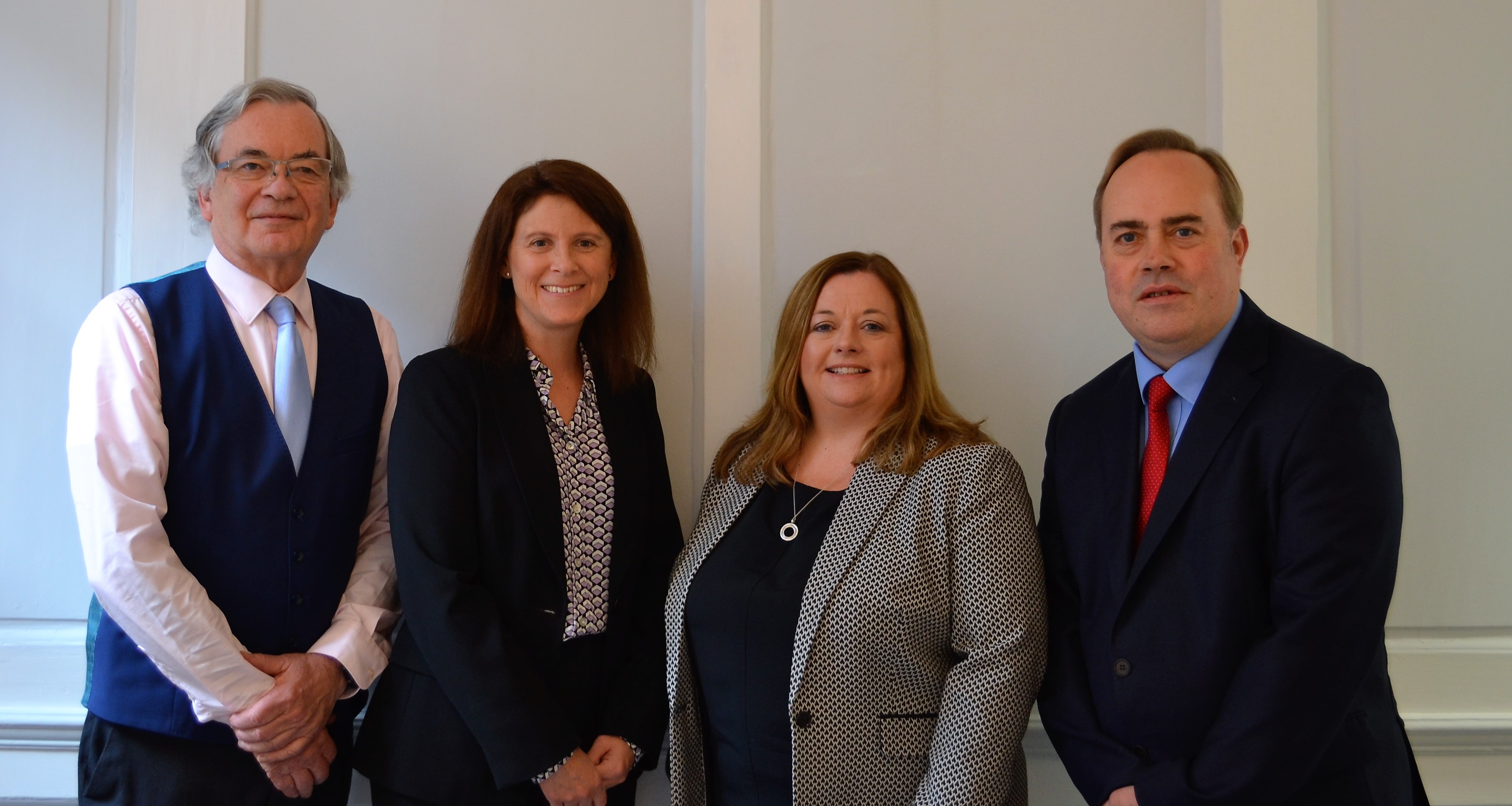Portrait image of the litigation team celebrating Deborah Lewis as an associate to lead the team.